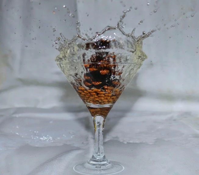 water splashing out of a glass