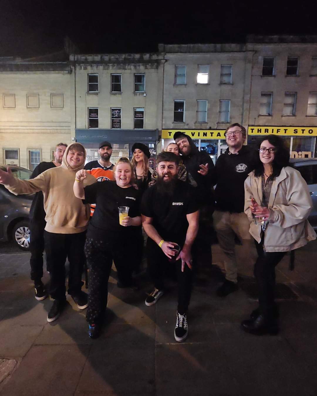 A group of the SHWSH members standing outside smiling at the camera