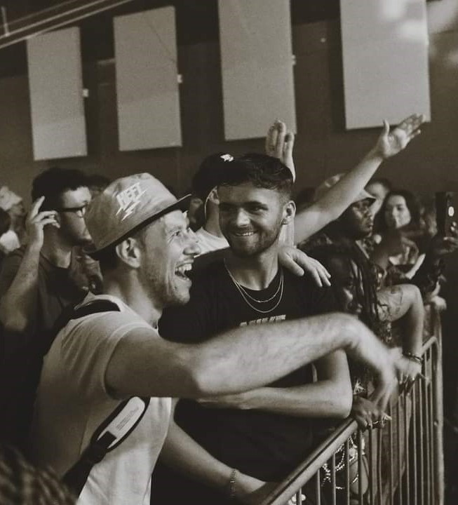 A crowd of people below a stage