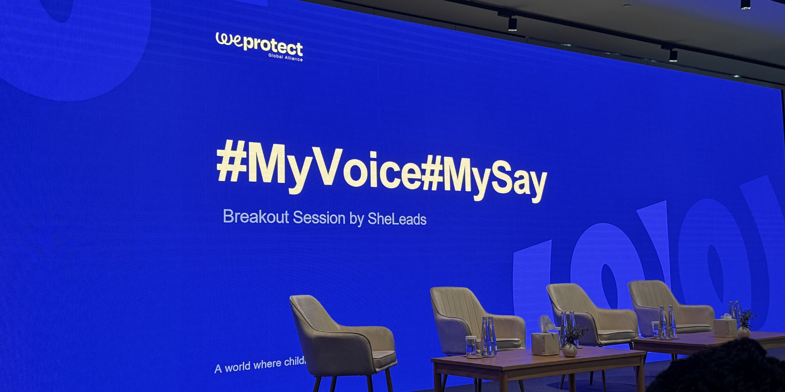 a screen on a stage that says #myvoice #mysay