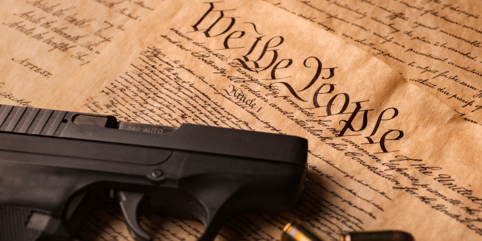 a gun on top of the us constitution