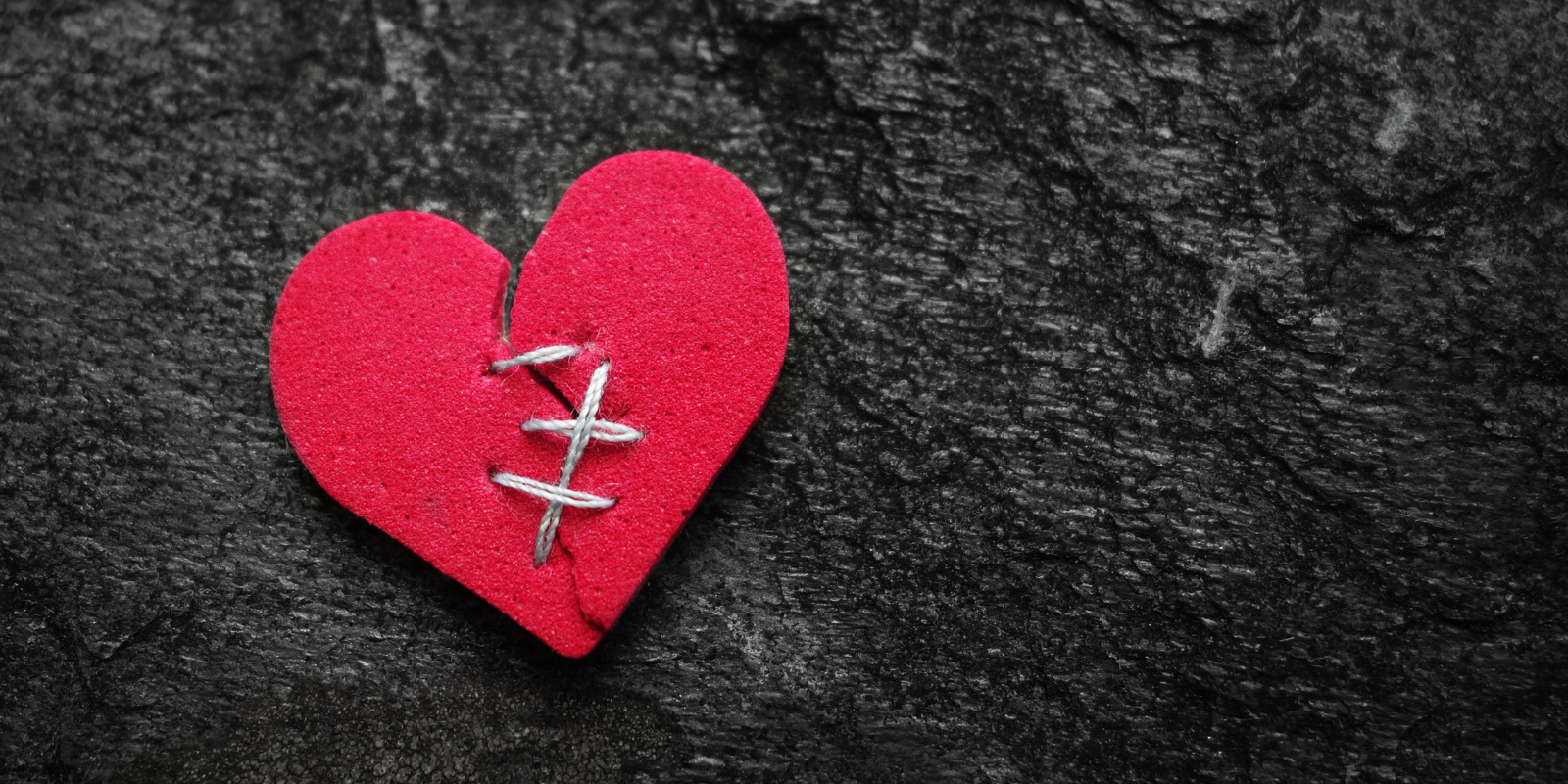 foam heart torn in half and stitched back together 