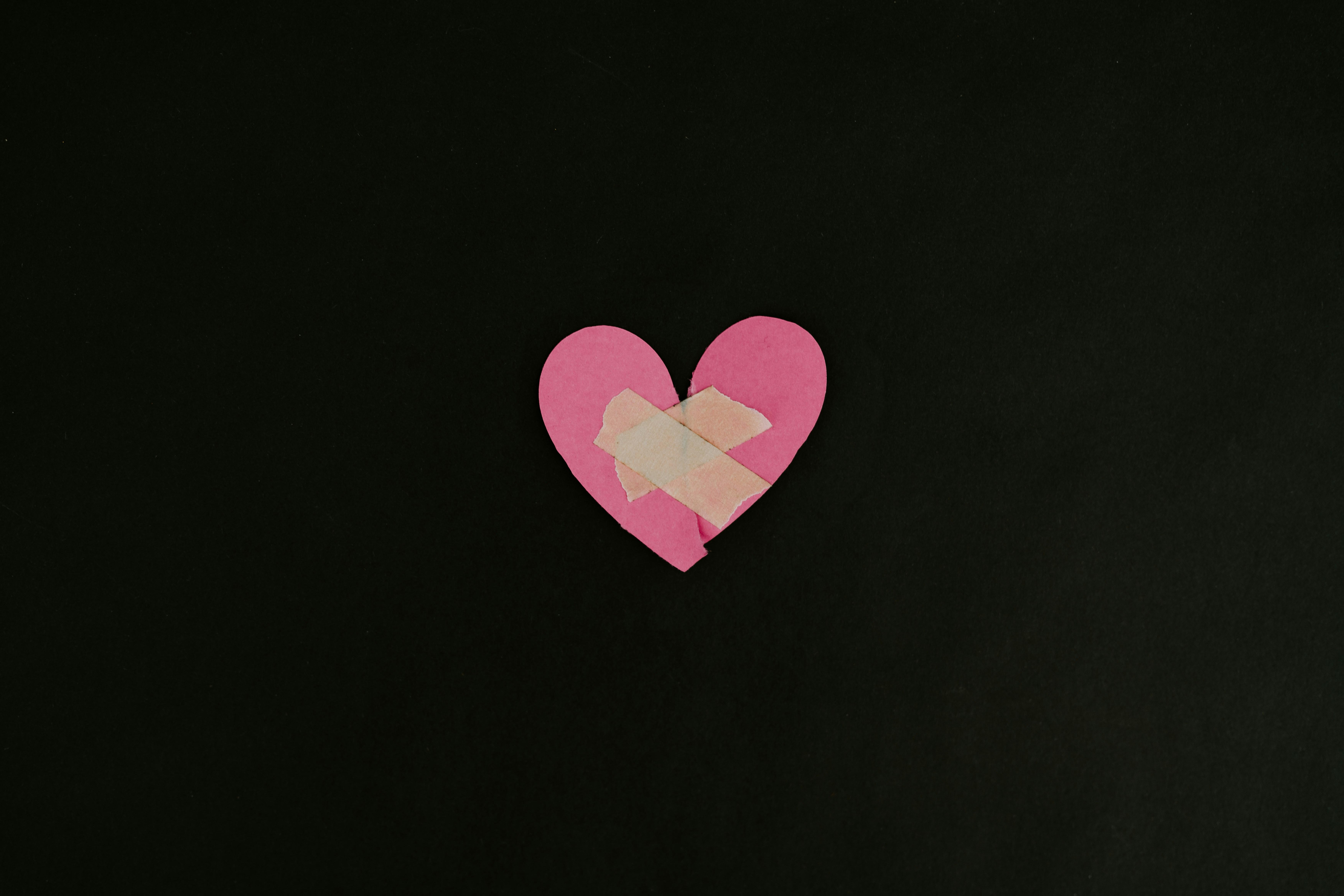 paper heart with bandaids on it