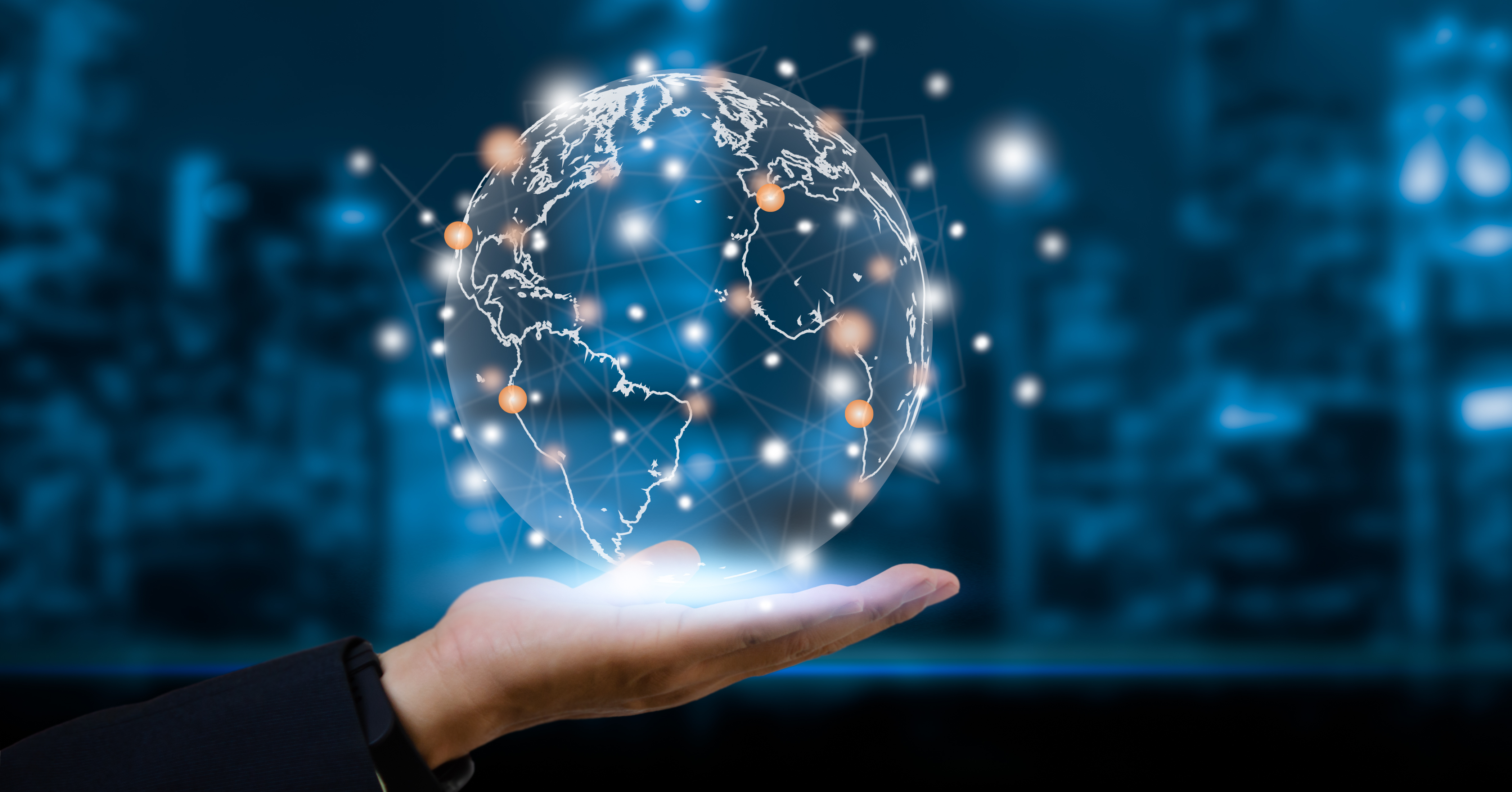 hand holding up a holographic globe