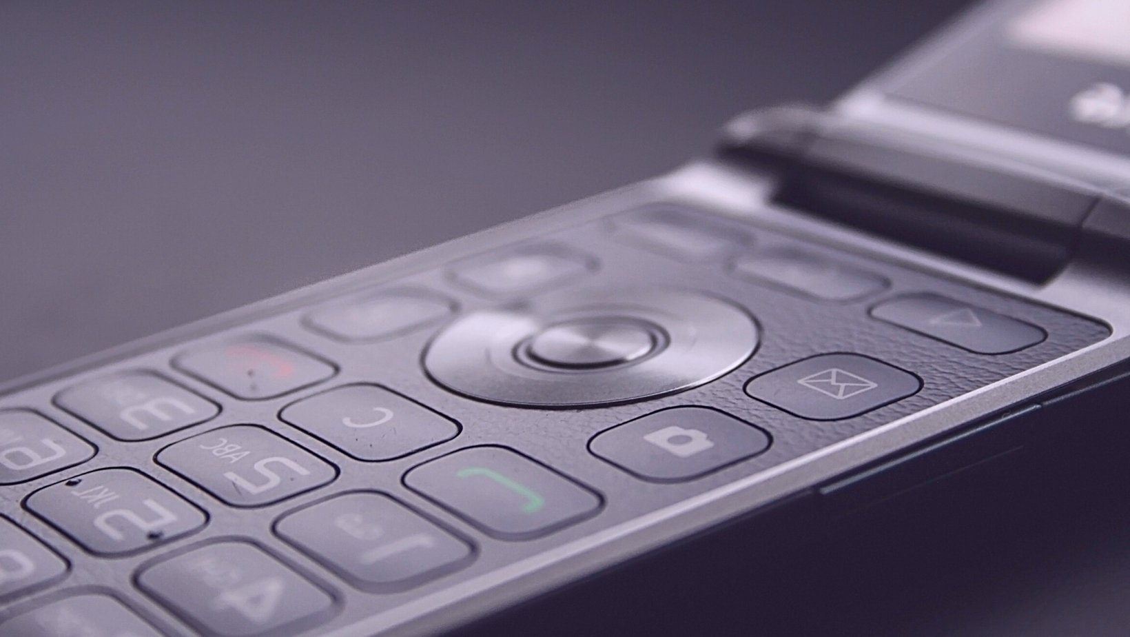 a close up photo of a flip phone keypad