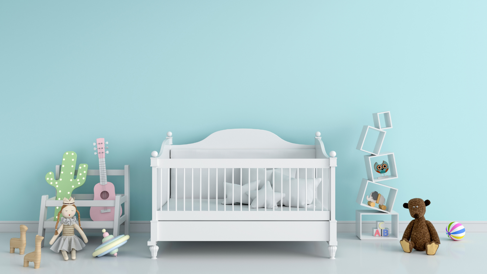 an image of an empty crib against a blue wall surrounded by toys