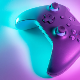 xbox controller on a teal and pink background