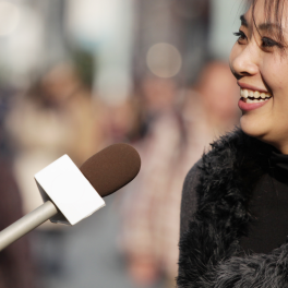 woman being interviewed on the street