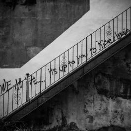 black and white photo of writing on a wal