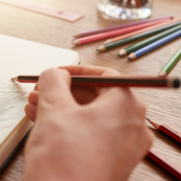woman sketching in a sketchbook