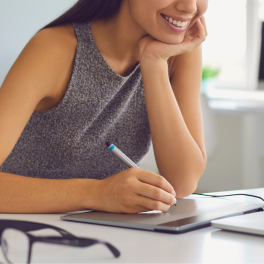 woman sitting at a desk on her laptop
