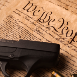 a gun on top of the us constitution
