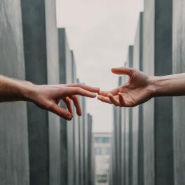 two hands reaching out to each other