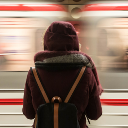 woman standing in front of a train