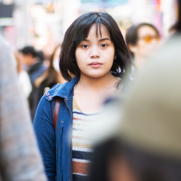 woman standing in a crowd