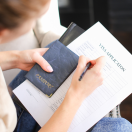 woman holding a visa application