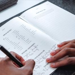 Hand writing in journal
