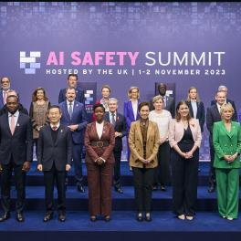 AI Summit attendees standing in a row