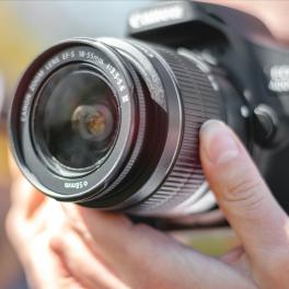 hands holding a camera