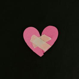 paper heart with bandaids on it