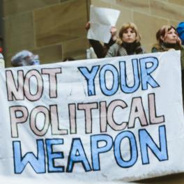 sign that reads "Not your political weapon"