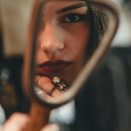 woman looking in the mirror