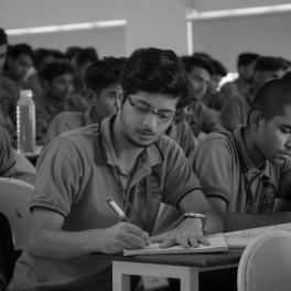 screenshot from the show Kota Factory - Black and white scene of students in a classroom