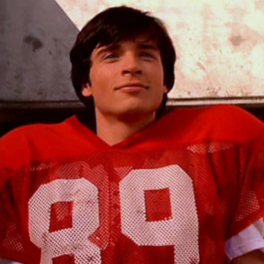 clark kent in a red football uniform
