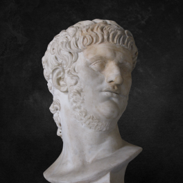 A bust of emperor Nero on a black background