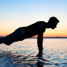 person planking in the ocean