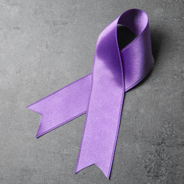 a purple ribbon on a gray background