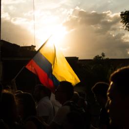 protesters holding Colombian flag