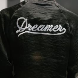 The back of a jacket that says "dreamer"