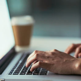 person typing on a laptop