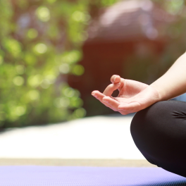 a woman sitting in a yoga pose