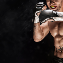 UFC fighter with fists up on a black background