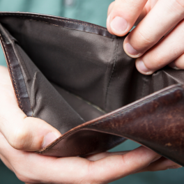 man holding an empty wallet open
