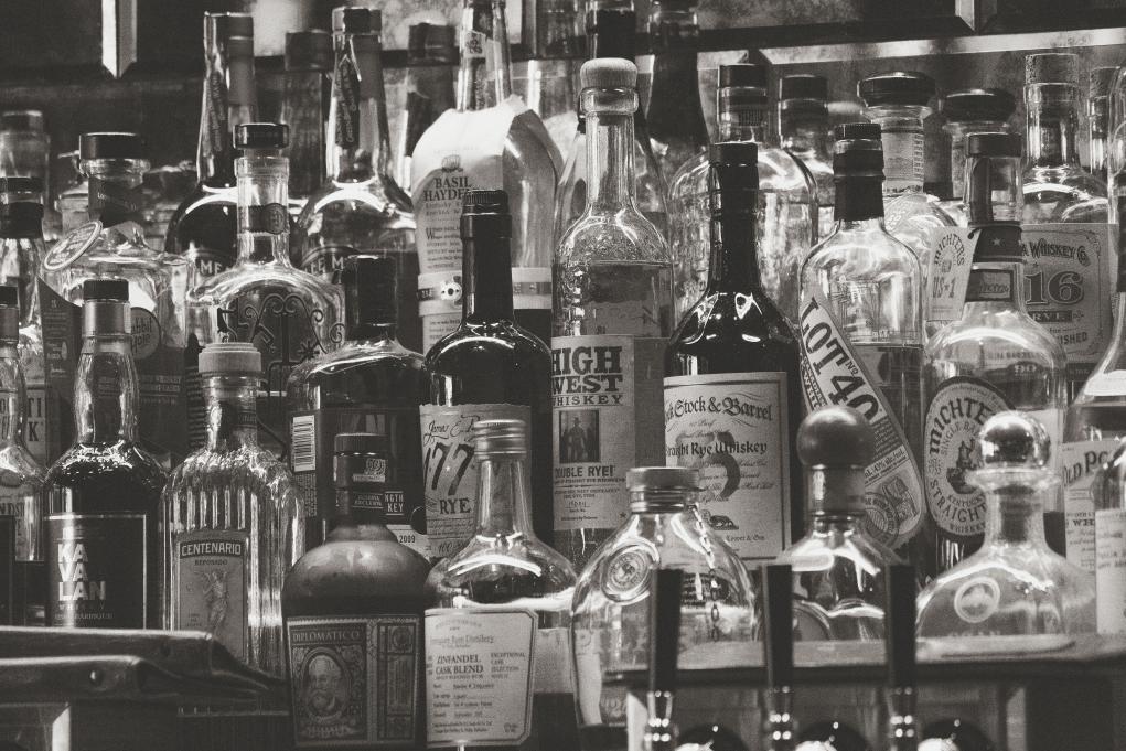 black and white image of alcohol bottles