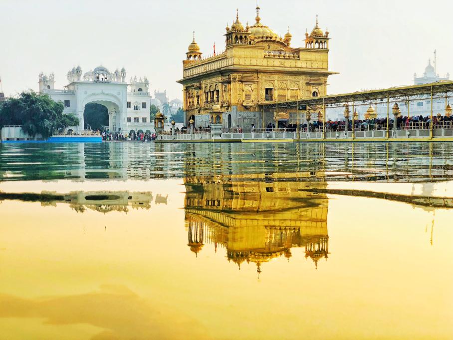 a temple and its reflection in the water