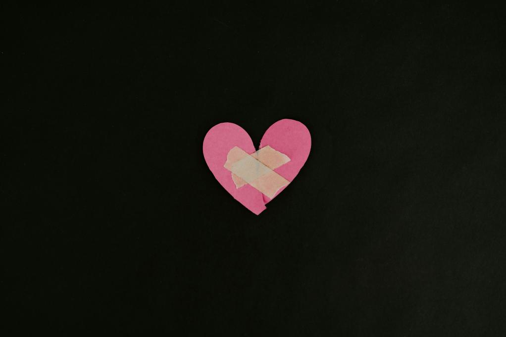 paper heart with bandaids on it