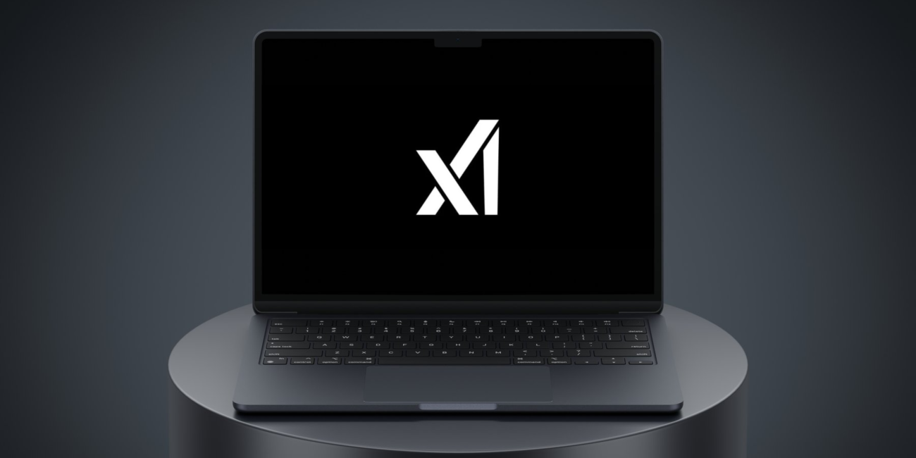 the X Ai logo on a black laptop 