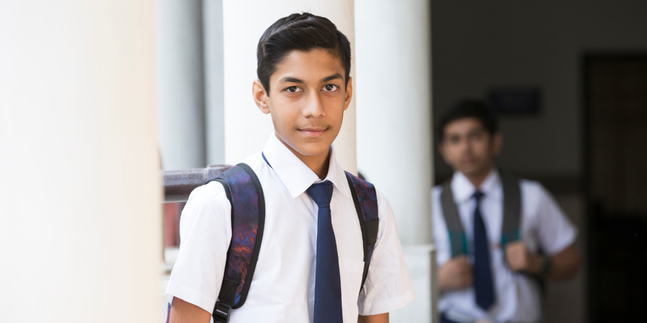 School boy in uniform looking at the camera