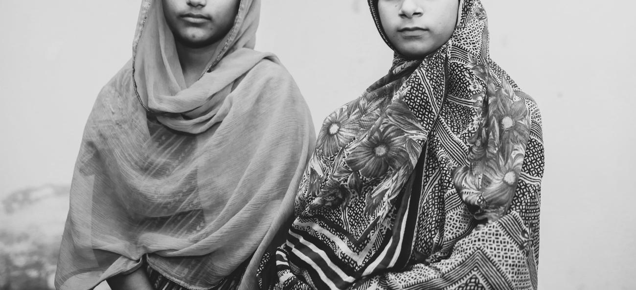 black and white photo of two young pakistani girls 