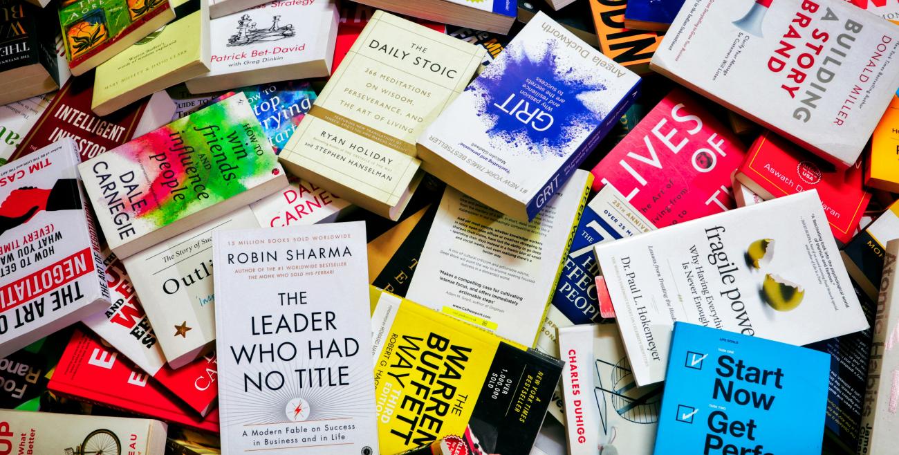 a pile of self help books 