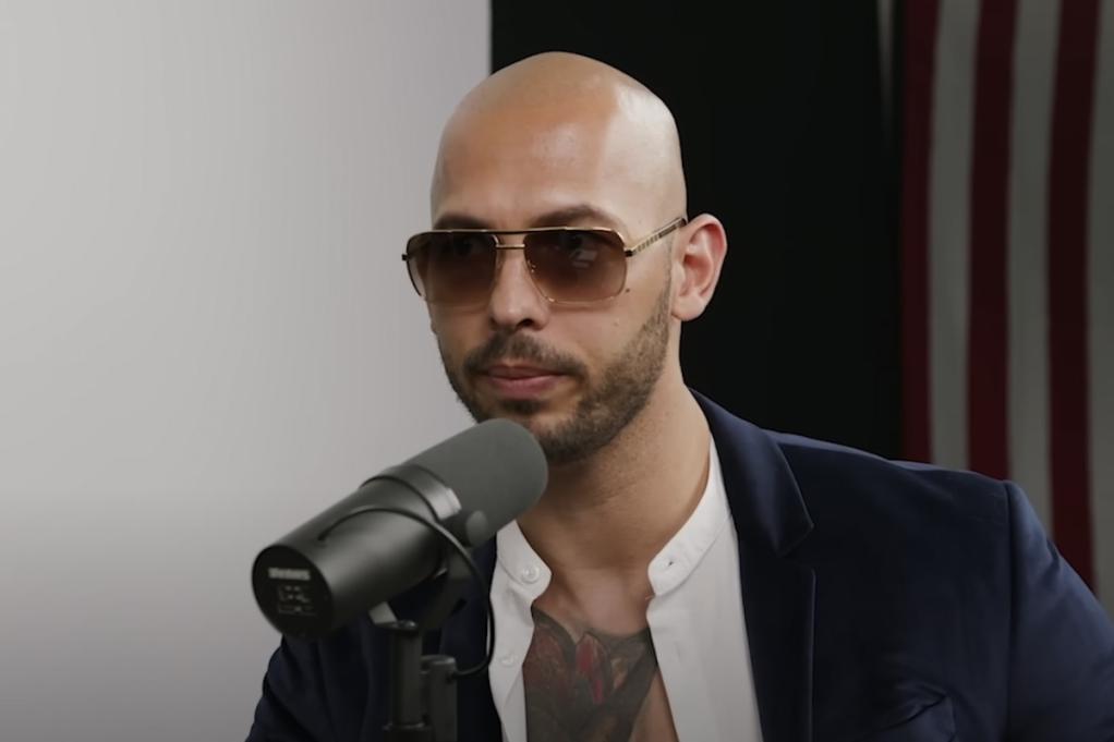 Andrew Tate talking into a microphone