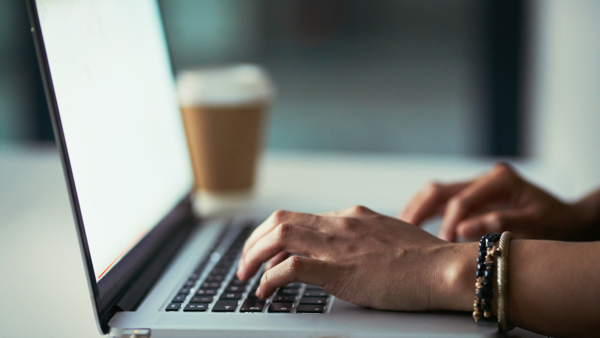 person typing on a laptop